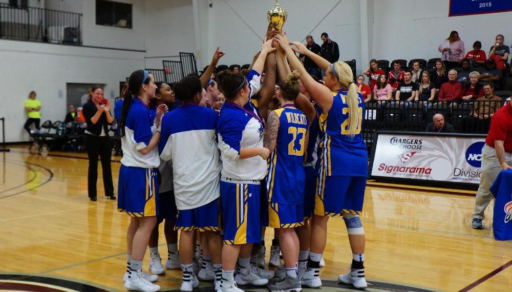 SUNY Poly hoisting its first NEAC Women's Basketball Championship Trophy in program history.